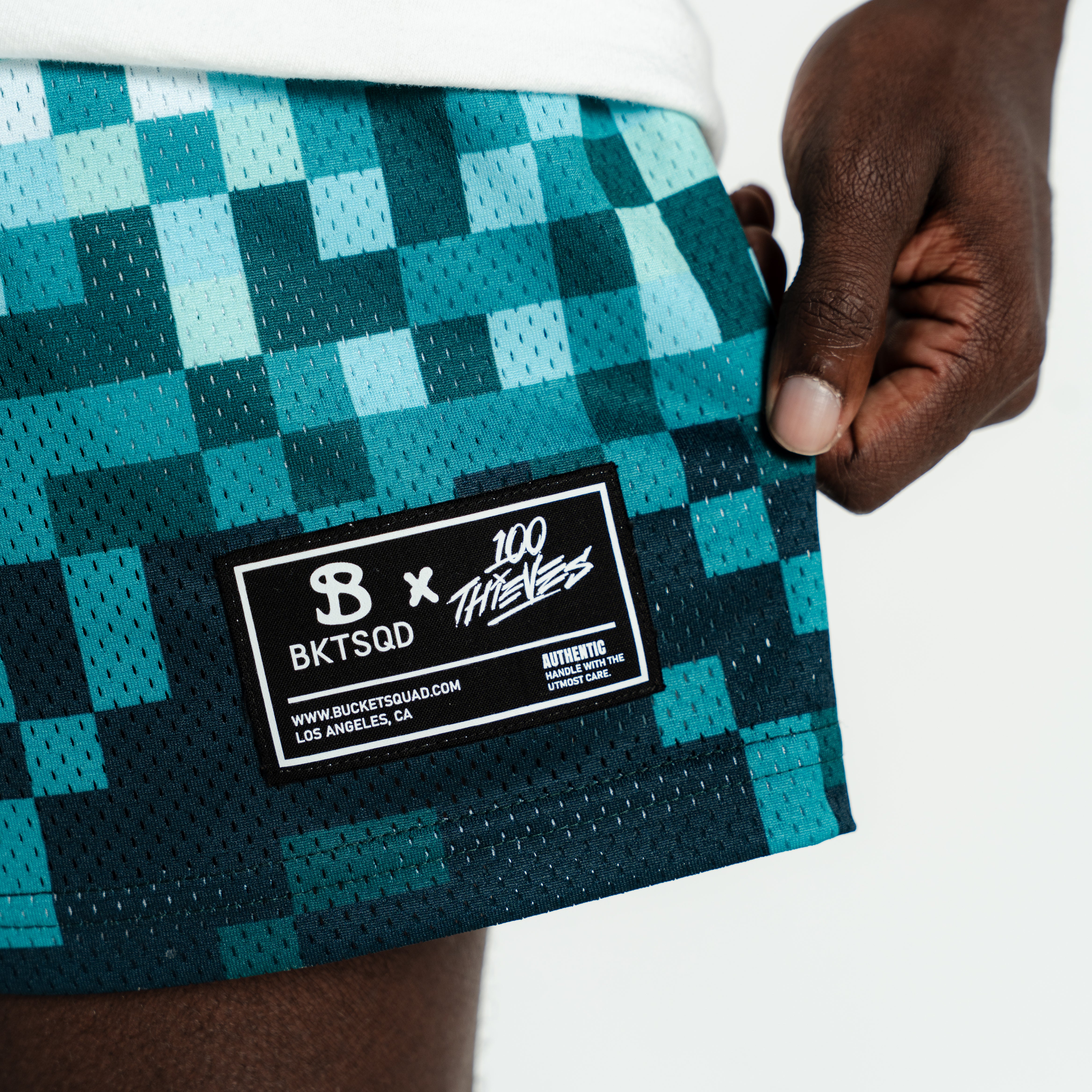 MINUS TIO BLOCK BASKET ミニュスティオ　ブロックバスケット Bucketsquad 100 Thieves Teal Pix Shorts | Adult Basketball Shorts